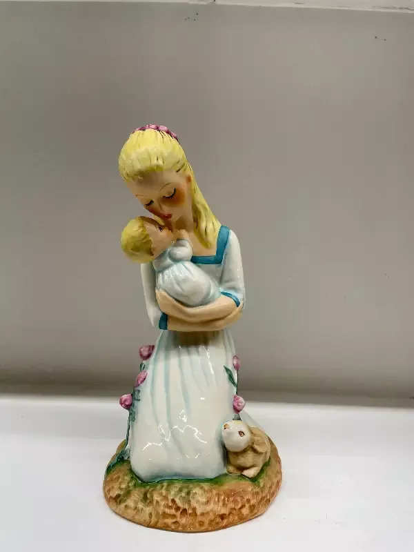 “Mother Embracing Child”